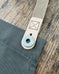 Doughnut hole buttons for removable straps.